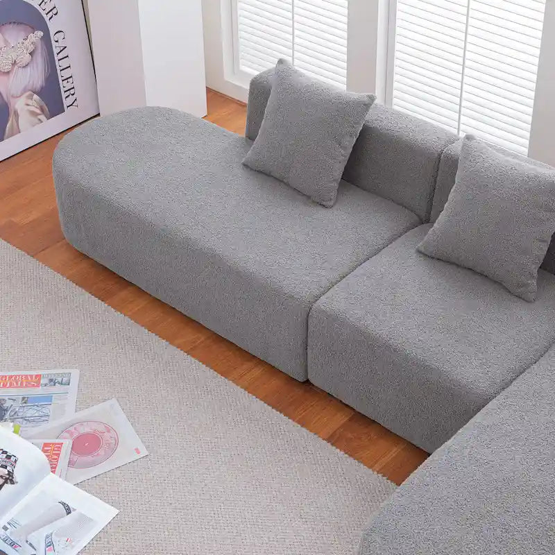 Canapé d'angle moderne en bouclette avec assise incurvée (côté droit)